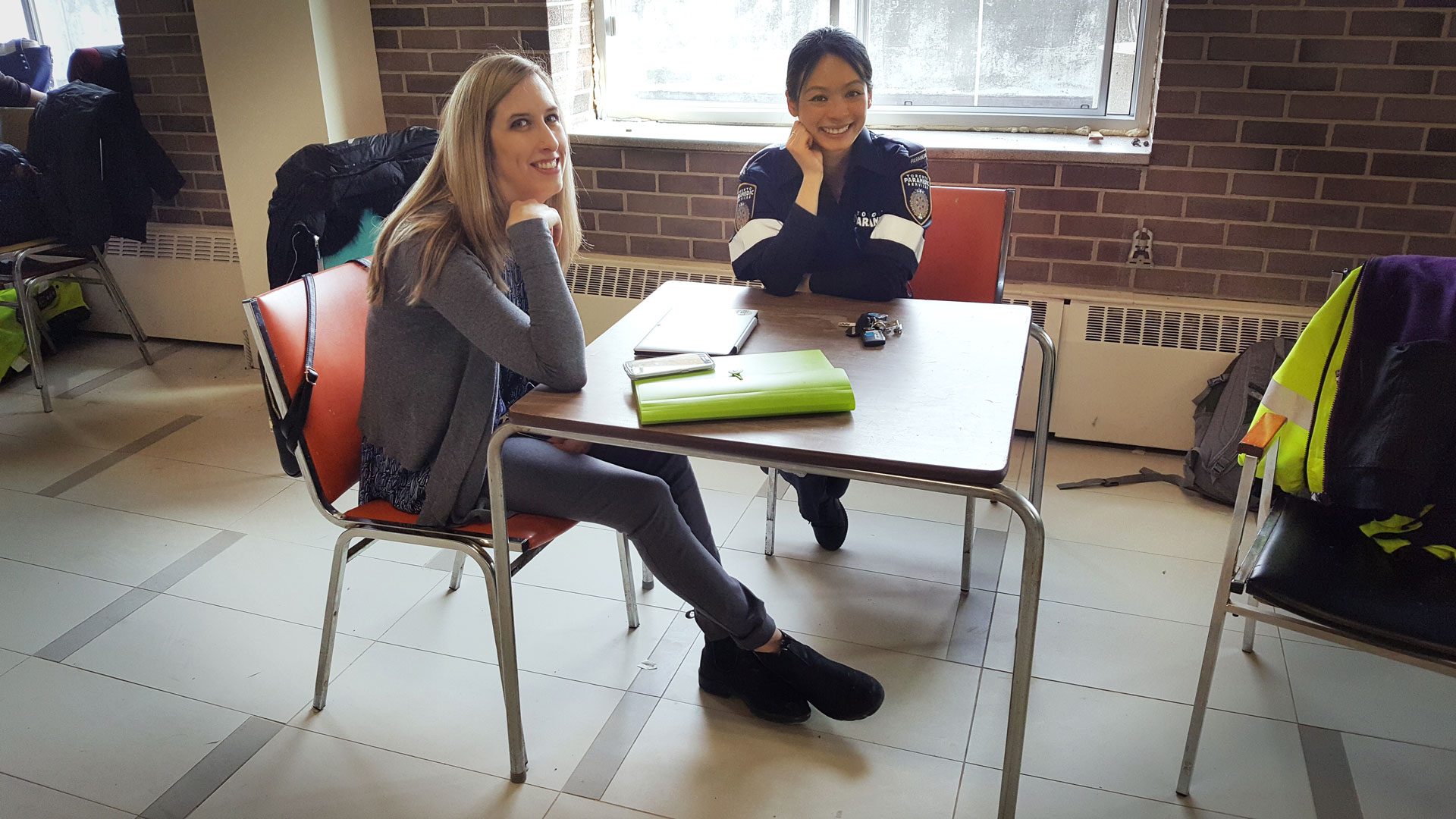 Sarah and Jessie sitting in a CPLC clinic space